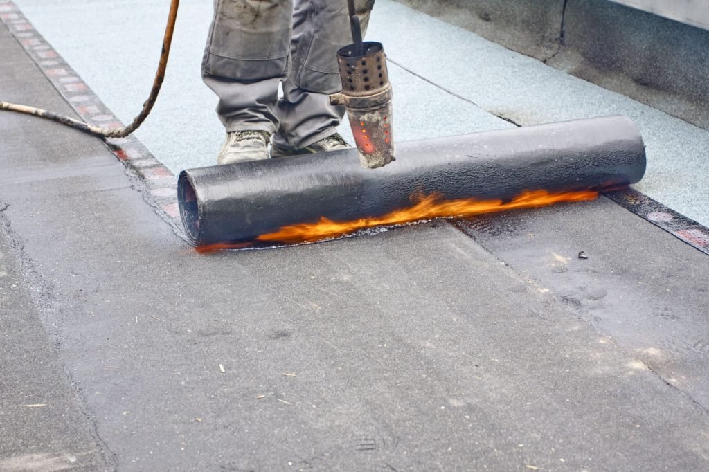 Aerial view of a completed flat roof with high-quality materials